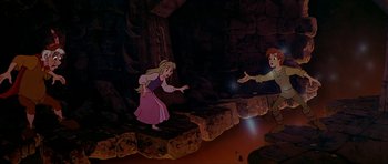 Movie still from “The Black Cauldron” (1985), directed by Ted Berman – A couple of people that are standing in the dirt; Wide shot, High angle