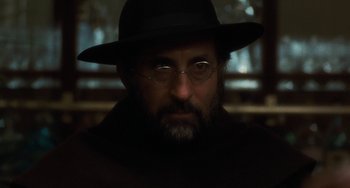 Movie still from “The Black Stallion” (1979), directed by Carroll Ballard – A man with a hat and glasses is looking at the camera; Close Up shot, Low angle