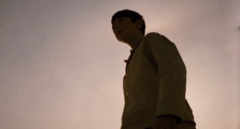 Movie still from “The Black Stallion” (1979), directed by Carroll Ballard – A man standing in the middle of the night; Close Up shot, Low angle