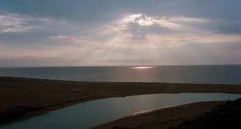Movie still from “The Black Stallion” (1979), directed by Carroll Ballard – A view of a body of water and a body of water; Extreme Wide shot, High angle