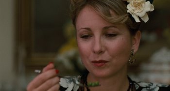 Movie still from “The Black Stallion” (1979), directed by Carroll Ballard – A person with a flower in her hair; Close Up shot, Over the shoulder angle