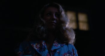 Movie still from “The Black Stallion” (1979), directed by Carroll Ballard – A woman with long blonde hair wearing a blue shirt; Close Up shot, Low angle