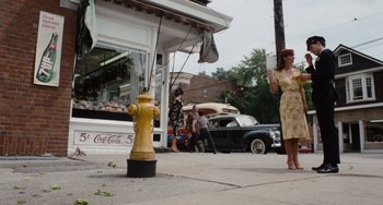 Movie still from “The Black Stallion” (1979), directed by Carroll Ballard – A yellow fire hydrant sitting on the side of a road; Wide shot, Low angle