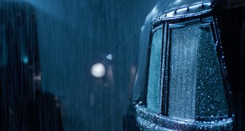 Movie still from “The Black Stallion” (1979), directed by Carroll Ballard – View of a bus window in the rain; Extreme Close Up shot, Over the shoulder angle
