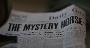 Movie still from “The Black Stallion” (1979), directed by Carroll Ballard – View of the front page of a newspaper; Extreme Close Up shot, Low angle