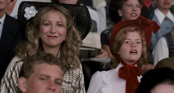 Movie still from “The Black Stallion” (1979), directed by Carroll Ballard – A woman and a girl in a crowd of people; Close Up shot, Over the shoulder angle