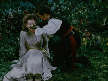 Movie still from “The Black Swan” (1942), directed by Henry King – A man and a woman dressed in medieval garb; Medium shot, High angle