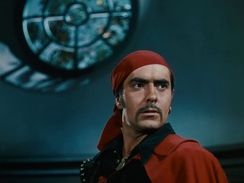 Movie still from “The Black Swan” (1942), directed by Henry King – A person wearing a pirate costume; Close Up shot, Low angle