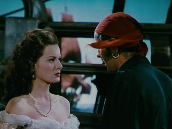 Movie still from “The Black Swan” (1942), directed by Henry King – A man and a woman are talking to each other; Close Up shot, Over the shoulder angle