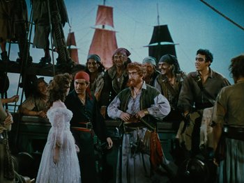 Movie still from “The Black Swan” (1942), directed by Henry King – A group of people dressed as pirates on a boat; Wide shot, High angle