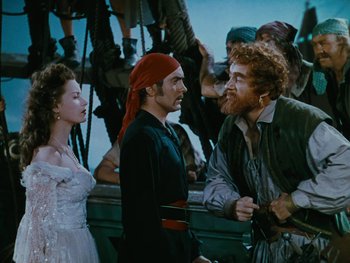 Movie still from “The Black Swan” (1942), directed by Henry King – A group of people standing next to each other on a boat; Medium shot, Over the shoulder angle