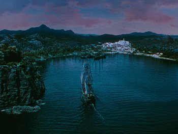 Movie still from “The Black Swan” (1942), directed by Henry King – An image of a man on a boat in the middle of a lake; Extreme Wide shot, High angle