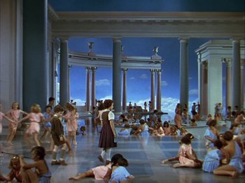 Movie still from “The Blue Bird” (1940), directed by Walter Lang – A group of people sitting and standing in a room; Extreme Wide shot, High angle