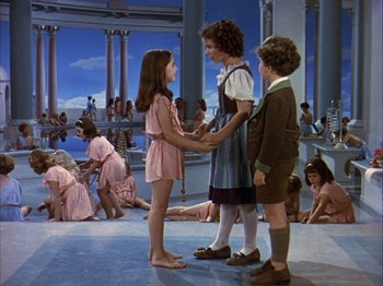 Movie still from “The Blue Bird” (1940), directed by Walter Lang – A group of young girls standing next to each other; Wide shot, High angle