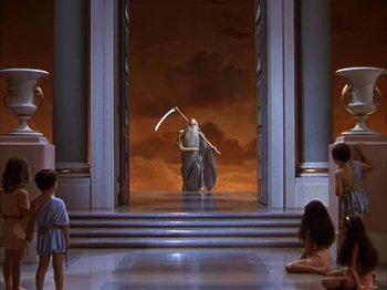 Movie still from “The Blue Bird” (1940), directed by Walter Lang – A man holding a scythe in front of an open door; Extreme Wide shot, High angle