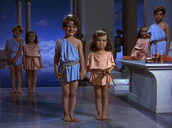 Movie still from “The Blue Bird” (1940), directed by Walter Lang – Two young children dressed in ancient roman clothing; Medium shot, High angle