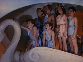 Movie still from “The Blue Bird” (1940), directed by Walter Lang – A group of young people dressed in ancient roman clothing; Medium shot, High angle