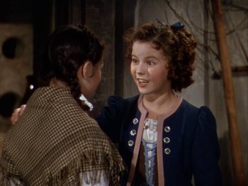 Movie still from “The Blue Bird” (1940), directed by Walter Lang – A young girl talking to a young boy in front of a tree; Medium shot, Over the shoulder angle