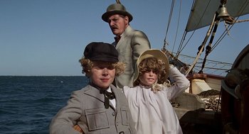 Movie still from “The Blue Lagoon” (1980), directed by Randal Kleiser – A man and two children on a boat; Medium shot, Low angle