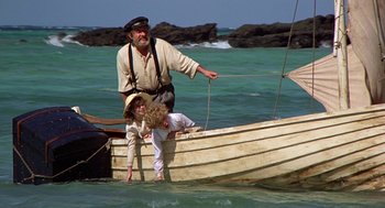 Movie still from “The Blue Lagoon” (1980), directed by Randal Kleiser – A man and a child on a boat in the ocean; Wide shot, High angle