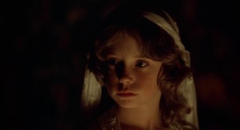 Movie still from “The Blue Lagoon” (1980), directed by Randal Kleiser – A young girl in a white dress with a white ribbon around her head; Close Up shot, Over the shoulder angle