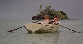 Movie still from “The Blue Lagoon” (1980), directed by Randal Kleiser – Three children are in a boat in the water; Wide shot, High angle