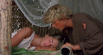 Movie still from “The Blue Lagoon” (1980), directed by Randal Kleiser – A man and a woman laying on the ground; Close Up shot, Low angle