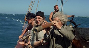 Movie still from “The Blue Lagoon” (1980), directed by Randal Kleiser – A group of people on a boat in the water; Medium shot, High angle
