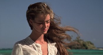Movie still from “The Blue Lagoon” (1980), directed by Randal Kleiser – A beautiful young woman with long brown hair; Close Up shot, Low angle