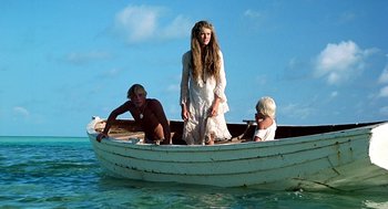 Movie still from “The Blue Lagoon” (1980), directed by Randal Kleiser – Three people in a boat in the water; Wide shot, Low angle