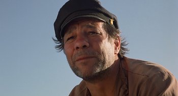 Movie still from “The Blue Lagoon” (1980), directed by Randal Kleiser – A person wearing a hat; Close Up shot, Low angle