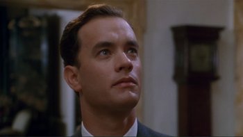 Movie still from “The Bonfire of the Vanities” (1990), directed by Brian De Palma – A man in a suit looking up at the sky; Close Up shot, Low angle