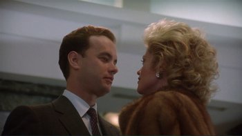 Movie still from “The Bonfire of the Vanities” (1990), directed by Brian De Palma – A man and a woman are looking at one another; Close Up shot, Low angle