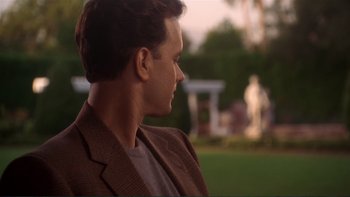 Movie still from “The Bonfire of the Vanities” (1990), directed by Brian De Palma – A person wearing a jacket; Close Up shot, Over the shoulder angle