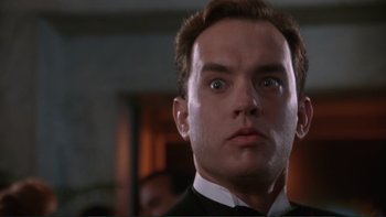 Movie still from “The Bonfire of the Vanities” (1990), directed by Brian De Palma – A man in a suit stares into the camera; Close Up shot, Low angle