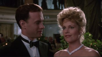 Movie still from “The Bonfire of the Vanities” (1990), directed by Brian De Palma – A man and a woman in formal wear standing next to each other; Close Up shot, Low angle