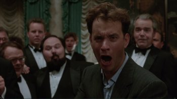 Movie still from “The Bonfire of the Vanities” (1990), directed by Brian De Palma – A group of men in tuxedos singing in a room; Close Up shot, Low angle