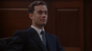 Movie still from “The Bonfire of the Vanities” (1990), directed by Brian De Palma – A man in a suit and tie; Close Up shot, Low angle