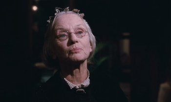 Movie still from “The Bostonians” (1984), directed by James Ivory – An older woman wearing glasses and wearing a crown; Close Up shot, Low angle