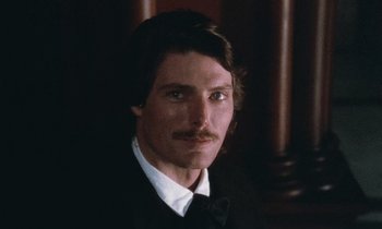 Movie still from “The Bostonians” (1984), directed by James Ivory – A person wearing a suit and tie; Close Up shot, High angle