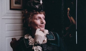 Movie still from “The Bostonians” (1984), directed by James Ivory – An older woman wearing a hat and gloves; Close Up shot, High angle