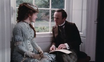 Movie still from “The Bostonians” (1984), directed by James Ivory – A man and a woman sitting next to each other; Medium shot, Over the shoulder angle