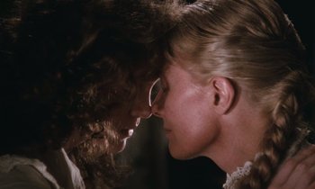 Movie still from “The Bostonians” (1984), directed by James Ivory – A man and a woman face to face in front of a dark background; Close Up shot, Over the shoulder angle