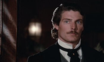 Movie still from “The Bostonians” (1984), directed by James Ivory – A person wearing a suit and tie; Close Up shot, Over the shoulder angle