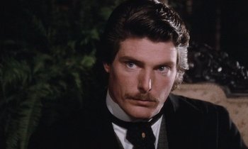 Movie still from “The Bostonians” (1984), directed by James Ivory – A man with a mustache wearing a suit and tie; Close Up shot, Over the shoulder angle