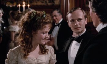 Movie still from “The Bostonians” (1984), directed by James Ivory – A man and a woman standing next to each other in formal wear; Close Up shot, Over the shoulder angle