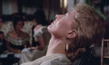 Movie still from “The Bostonians” (1984), directed by James Ivory – A woman in a white dress is looking up at the sky; Close Up shot, Low angle