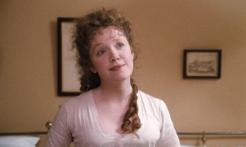 Movie still from “The Bostonians” (1984), directed by James Ivory – A young woman with long hair and blue eyes; Close Up shot, Over the shoulder angle
