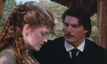 Movie still from “The Bostonians” (1984), directed by James Ivory – A man and a woman standing next to each other under an umbrella; Close Up shot, Over the shoulder angle