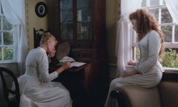Movie still from “The Bostonians” (1984), directed by James Ivory – Two women sitting in front of a window; Medium shot, High angle